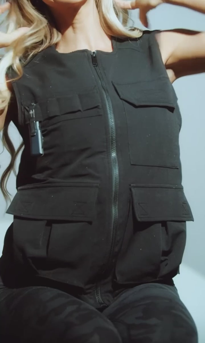 Close-up of Soft Shell Bulletproof Vest features — zippered front, secure utility pockets